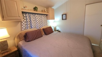 UPDATED SINGLE WIDE MOBILE HOME IN ACTIVE 55+ COMMUNITY! Stay on River Run Golf Links in Florida - for sale on GolfHomes.com, golf home, golf lot