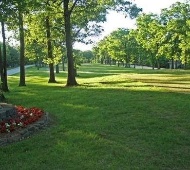 Nestled on a scenic lot along the 18 hole golf course in on Holiday Island Golf Course in Arkansas - for sale on GolfHomes.com, golf home, golf lot
