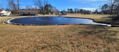 Nestled on a scenic lot along the 18 hole golf course in on Holiday Island Golf Course in Arkansas - for sale on GolfHomes.com, golf home, golf lot