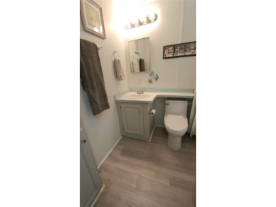 UPDATED SINGLE WIDE MOBILE HOME IN ACTIVE 55+ COMMUNITY! Stay on River Run Golf Links in Florida - for sale on GolfHomes.com, golf home, golf lot