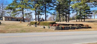 Nestled on a scenic lot along the 18 hole golf course in on Holiday Island Golf Course in Arkansas - for sale on GolfHomes.com, golf home, golf lot