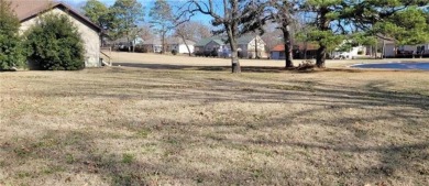 Nestled on a scenic lot along the 18 hole golf course in on Holiday Island Golf Course in Arkansas - for sale on GolfHomes.com, golf home, golf lot