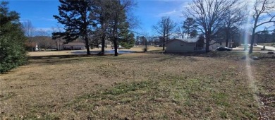 Nestled on a scenic lot along the 18 hole golf course in on Holiday Island Golf Course in Arkansas - for sale on GolfHomes.com, golf home, golf lot
