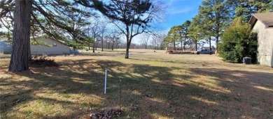 Nestled on a scenic lot along the 18 hole golf course in on Holiday Island Golf Course in Arkansas - for sale on GolfHomes.com, golf home, golf lot