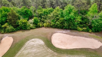 Build your dream home on this .74 acre, corner lot located on on Foxfire Golf and Country Club in North Carolina - for sale on GolfHomes.com, golf home, golf lot