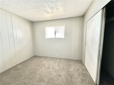 This charming 2 bedroom, 2 bathroom mobile home is located in on Hidden Springs Country Club in California - for sale on GolfHomes.com, golf home, golf lot