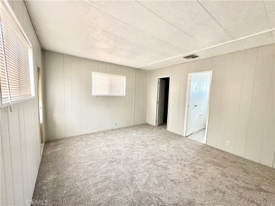 This charming 2 bedroom, 2 bathroom mobile home is located in on Hidden Springs Country Club in California - for sale on GolfHomes.com, golf home, golf lot