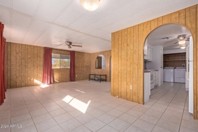 This charming 3-bedroom, 1.75-bath home is nestled on a quiet on Fountain of the Sun Country Club in Arizona - for sale on GolfHomes.com, golf home, golf lot