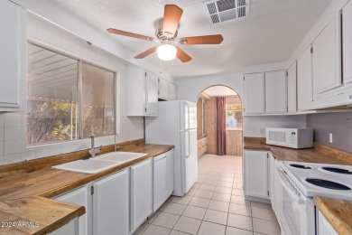 This charming 3-bedroom, 1.75-bath home is nestled on a quiet on Fountain of the Sun Country Club in Arizona - for sale on GolfHomes.com, golf home, golf lot