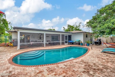 Discover this Delray Beach 4-bedroom, 2.5 bath pool home on Delray Beach Golf Club in Florida - for sale on GolfHomes.com, golf home, golf lot