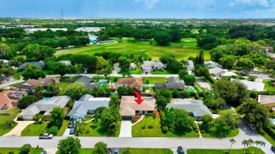 Discover this Delray Beach 4-bedroom, 2.5 bath pool home on Delray Beach Golf Club in Florida - for sale on GolfHomes.com, golf home, golf lot