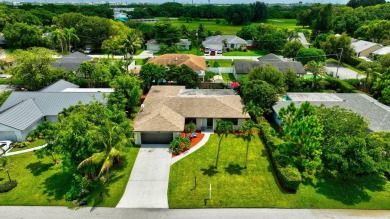 Discover this Delray Beach 4-bedroom, 2.5 bath pool home on Delray Beach Golf Club in Florida - for sale on GolfHomes.com, golf home, golf lot