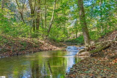 This charming mountain getaway offers a great location for all on The Rock At Jocassee in South Carolina - for sale on GolfHomes.com, golf home, golf lot