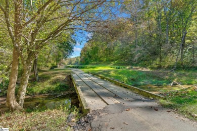 This charming mountain getaway offers a great location for all on The Rock At Jocassee in South Carolina - for sale on GolfHomes.com, golf home, golf lot