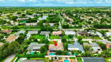 Discover this Delray Beach 4-bedroom, 2.5 bath pool home on Delray Beach Golf Club in Florida - for sale on GolfHomes.com, golf home, golf lot