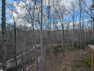 This charming mountain getaway offers a great location for all on The Rock At Jocassee in South Carolina - for sale on GolfHomes.com, golf home, golf lot
