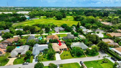 Discover this Delray Beach 4-bedroom, 2.5 bath pool home on Delray Beach Golf Club in Florida - for sale on GolfHomes.com, golf home, golf lot