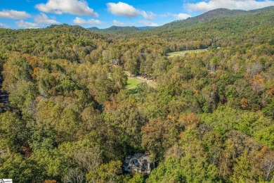 This charming mountain getaway offers a great location for all on The Rock At Jocassee in South Carolina - for sale on GolfHomes.com, golf home, golf lot