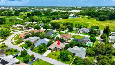 Discover this Delray Beach 4-bedroom, 2.5 bath pool home on Delray Beach Golf Club in Florida - for sale on GolfHomes.com, golf home, golf lot