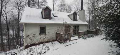 This charming mountain getaway offers a great location for all on The Rock At Jocassee in South Carolina - for sale on GolfHomes.com, golf home, golf lot