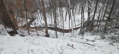 This charming mountain getaway offers a great location for all on The Rock At Jocassee in South Carolina - for sale on GolfHomes.com, golf home, golf lot