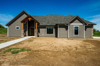 This beautifully crafted 3-bedroom, 2.5-bath home in the Powder on The Powder Horn Golf Club - Mountain in Wyoming - for sale on GolfHomes.com, golf home, golf lot