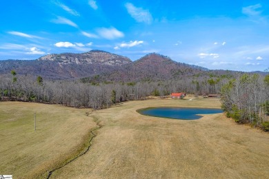 This charming mountain getaway offers a great location for all on The Rock At Jocassee in South Carolina - for sale on GolfHomes.com, golf home, golf lot