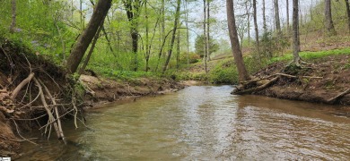 This charming mountain getaway offers a great location for all on The Rock At Jocassee in South Carolina - for sale on GolfHomes.com, golf home, golf lot