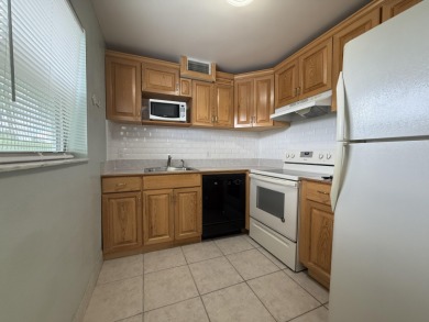 Ground floor 2 bedroom, 2 bath true corner unit with canal view on Addison Reserve in Florida - for sale on GolfHomes.com, golf home, golf lot