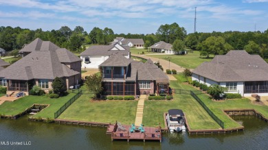 Beautiful waterfront home in the gated community of the Shores on Lake Caroline Golf Club in Mississippi - for sale on GolfHomes.com, golf home, golf lot