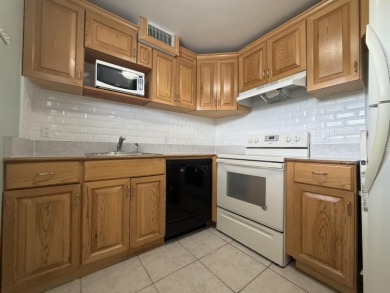 Ground floor 2 bedroom, 2 bath true corner unit with canal view on Addison Reserve in Florida - for sale on GolfHomes.com, golf home, golf lot
