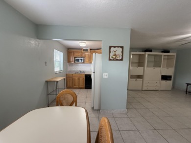 Ground floor 2 bedroom, 2 bath true corner unit with canal view on Addison Reserve in Florida - for sale on GolfHomes.com, golf home, golf lot