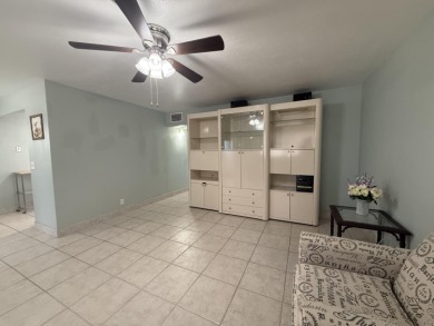 Ground floor 2 bedroom, 2 bath true corner unit with canal view on Addison Reserve in Florida - for sale on GolfHomes.com, golf home, golf lot