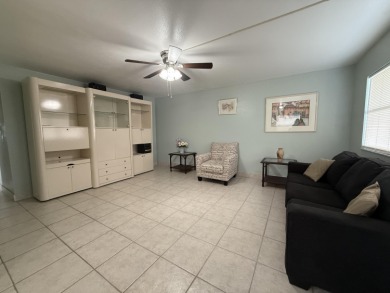 Ground floor 2 bedroom, 2 bath true corner unit with canal view on Addison Reserve in Florida - for sale on GolfHomes.com, golf home, golf lot