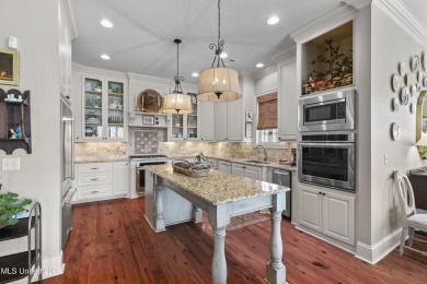 Beautiful waterfront home in the gated community of the Shores on Lake Caroline Golf Club in Mississippi - for sale on GolfHomes.com, golf home, golf lot