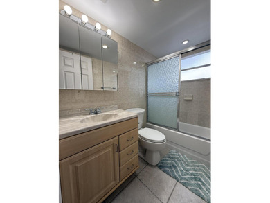 Ground floor 2 bedroom, 2 bath true corner unit with canal view on Addison Reserve in Florida - for sale on GolfHomes.com, golf home, golf lot