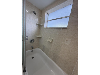 Ground floor 2 bedroom, 2 bath true corner unit with canal view on Addison Reserve in Florida - for sale on GolfHomes.com, golf home, golf lot
