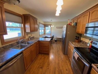 Take a look at this attractive ranch style home located adjacent on Split Rock Country Club in South Dakota - for sale on GolfHomes.com, golf home, golf lot