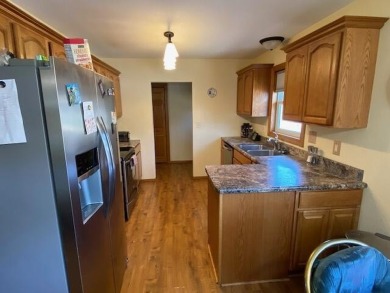 Take a look at this attractive ranch style home located adjacent on Split Rock Country Club in South Dakota - for sale on GolfHomes.com, golf home, golf lot