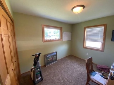 Take a look at this attractive ranch style home located adjacent on Split Rock Country Club in South Dakota - for sale on GolfHomes.com, golf home, golf lot