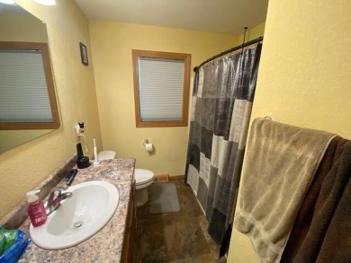 Take a look at this attractive ranch style home located adjacent on Split Rock Country Club in South Dakota - for sale on GolfHomes.com, golf home, golf lot