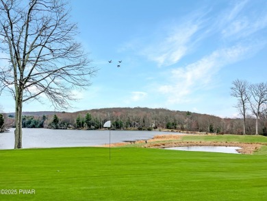 Tucked at the end of a quiet cul-de-sac and overlooking a on Paupack Hills Golf and Country Club in Pennsylvania - for sale on GolfHomes.com, golf home, golf lot