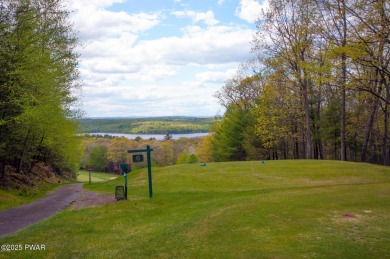 Tucked at the end of a quiet cul-de-sac and overlooking a on Paupack Hills Golf and Country Club in Pennsylvania - for sale on GolfHomes.com, golf home, golf lot