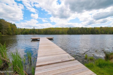 Tucked at the end of a quiet cul-de-sac and overlooking a on Paupack Hills Golf and Country Club in Pennsylvania - for sale on GolfHomes.com, golf home, golf lot