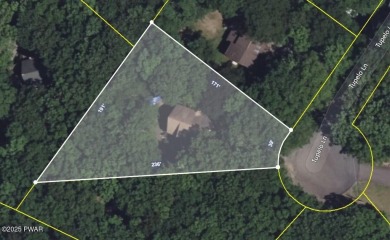 Tucked at the end of a quiet cul-de-sac and overlooking a on Paupack Hills Golf and Country Club in Pennsylvania - for sale on GolfHomes.com, golf home, golf lot