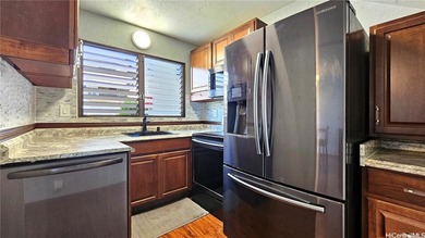 Charming 2-bedroom, 1.5-bath perimeter townhome that sits along on Pearl Country Club in Hawaii - for sale on GolfHomes.com, golf home, golf lot