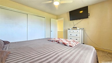 Charming 2-bedroom, 1.5-bath perimeter townhome that sits along on Pearl Country Club in Hawaii - for sale on GolfHomes.com, golf home, golf lot