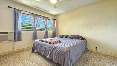 Charming 2-bedroom, 1.5-bath perimeter townhome that sits along on Pearl Country Club in Hawaii - for sale on GolfHomes.com, golf home, golf lot