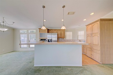 Welcome to your dream abode, nestled on a desirable corner lot on Brookridge Country Club in Florida - for sale on GolfHomes.com, golf home, golf lot