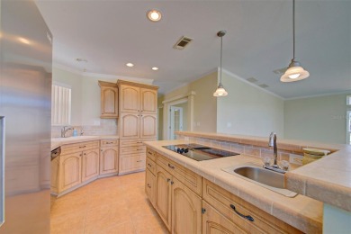 Welcome to your dream abode, nestled on a desirable corner lot on Brookridge Country Club in Florida - for sale on GolfHomes.com, golf home, golf lot